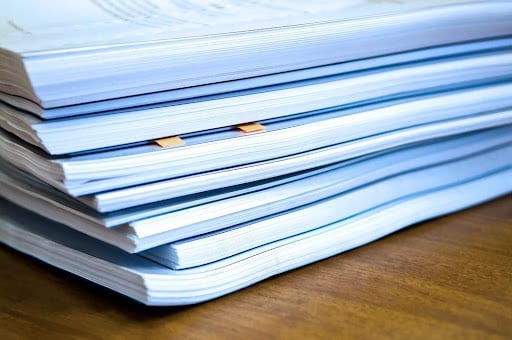 stack of papers about Certificate Of Insurance Tracking Services